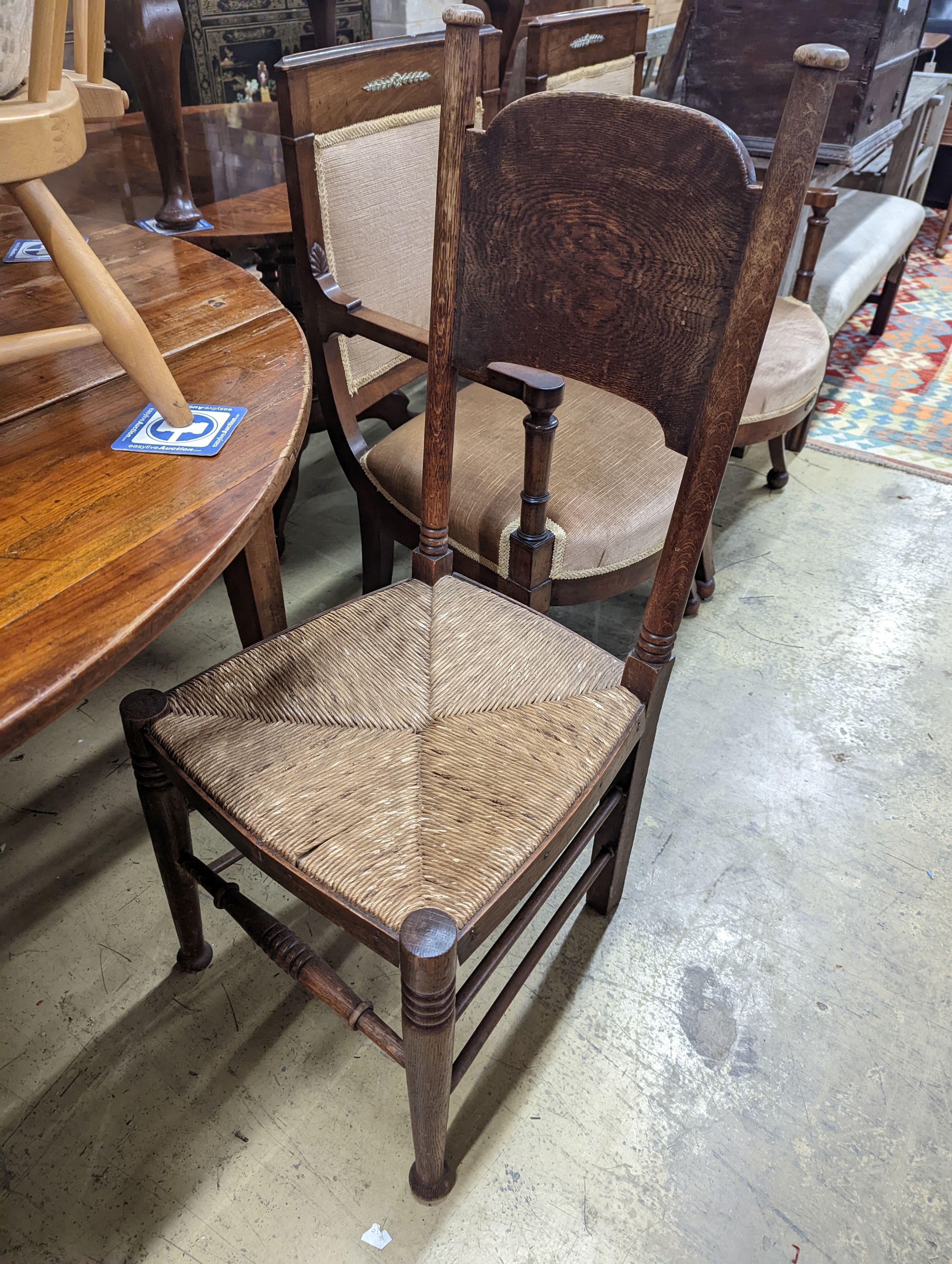 A set of six Arts & Crafts oak chairs, including a pair of carvers, in the Glasgow School manner by William Birch, High Wycombe, carvers W.58cm D.54cm H.109cm